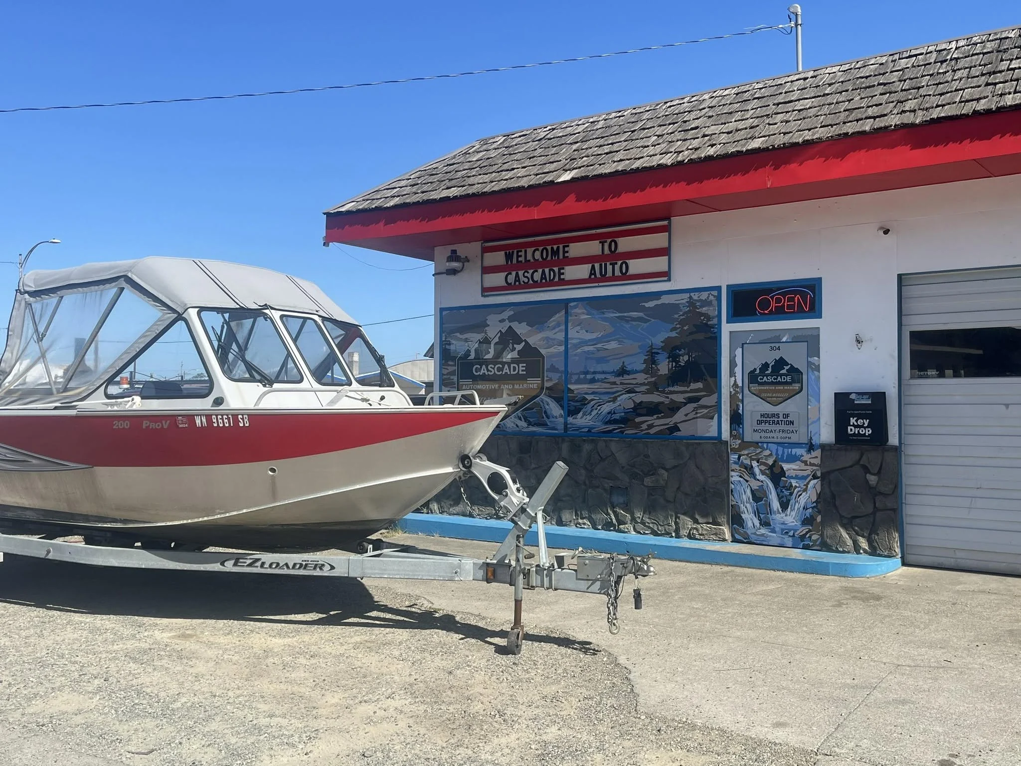 Aluminum fishing boat in front of the Cascade shop